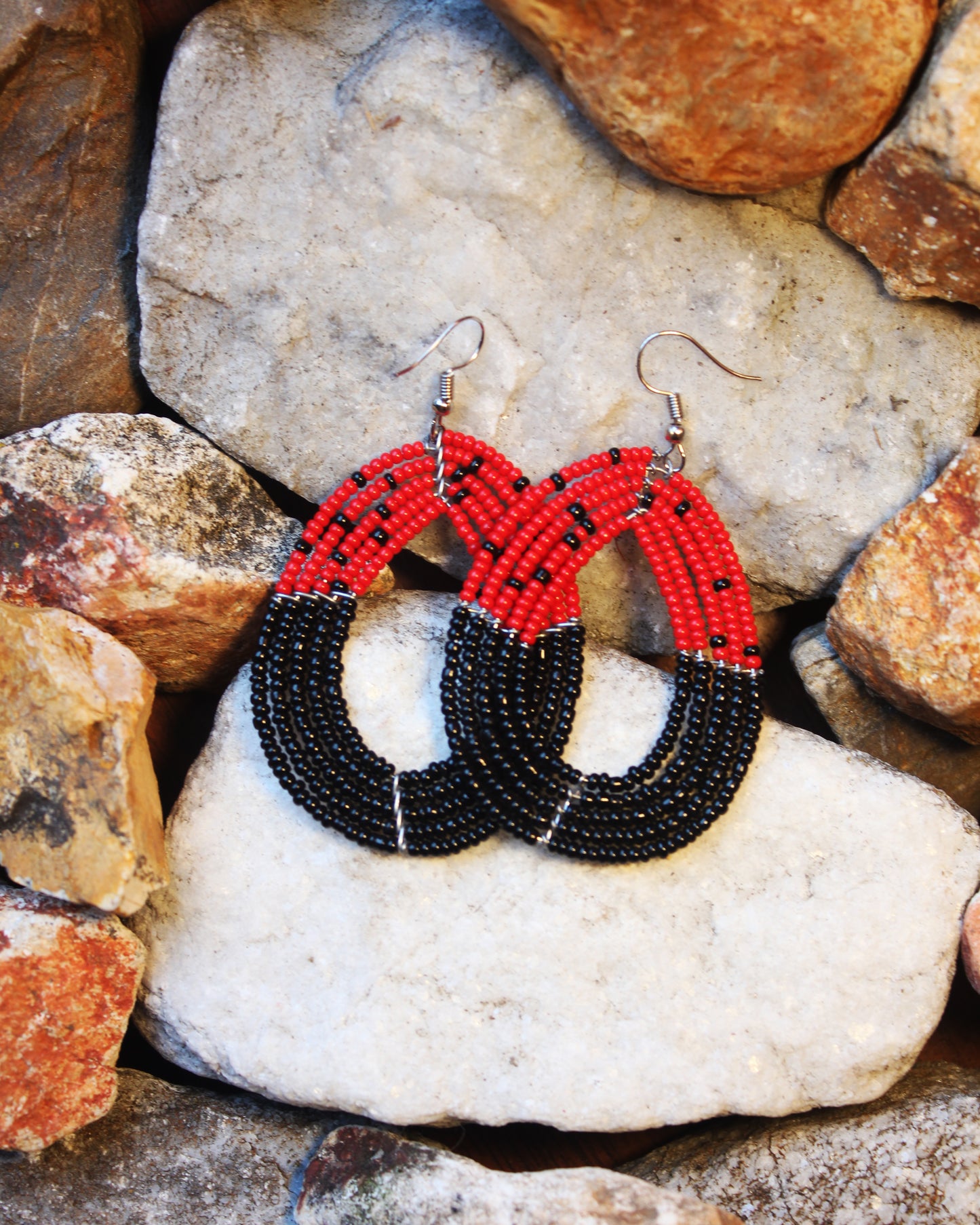 Red And Black Colored Oval Maasai Handmade Beaded Ear Rings with sterling silver hooks.