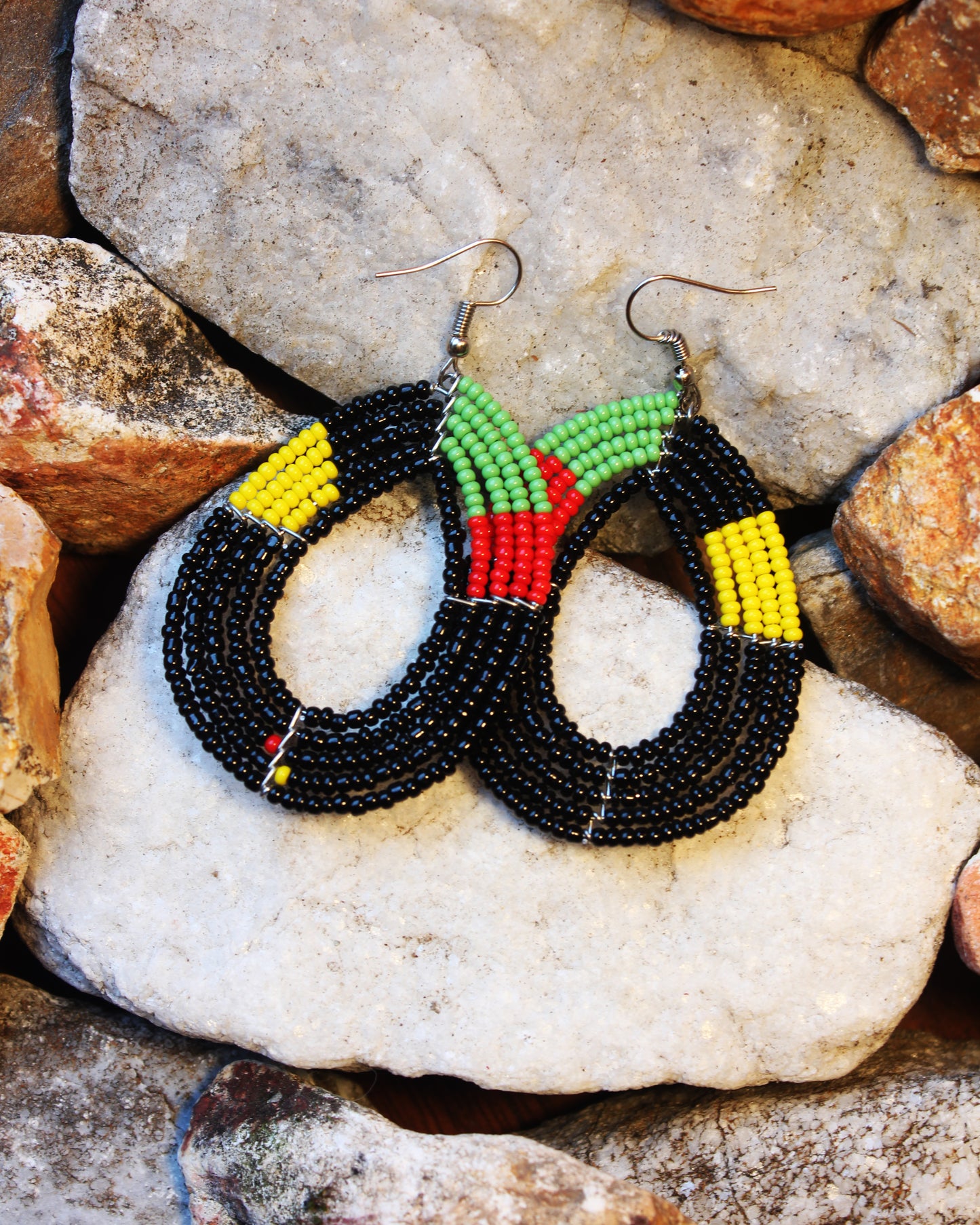 Black, Red, Green, Yellow Colored Oval Maasai Handmade Beaded Ear Rings with sterling silver hooks.